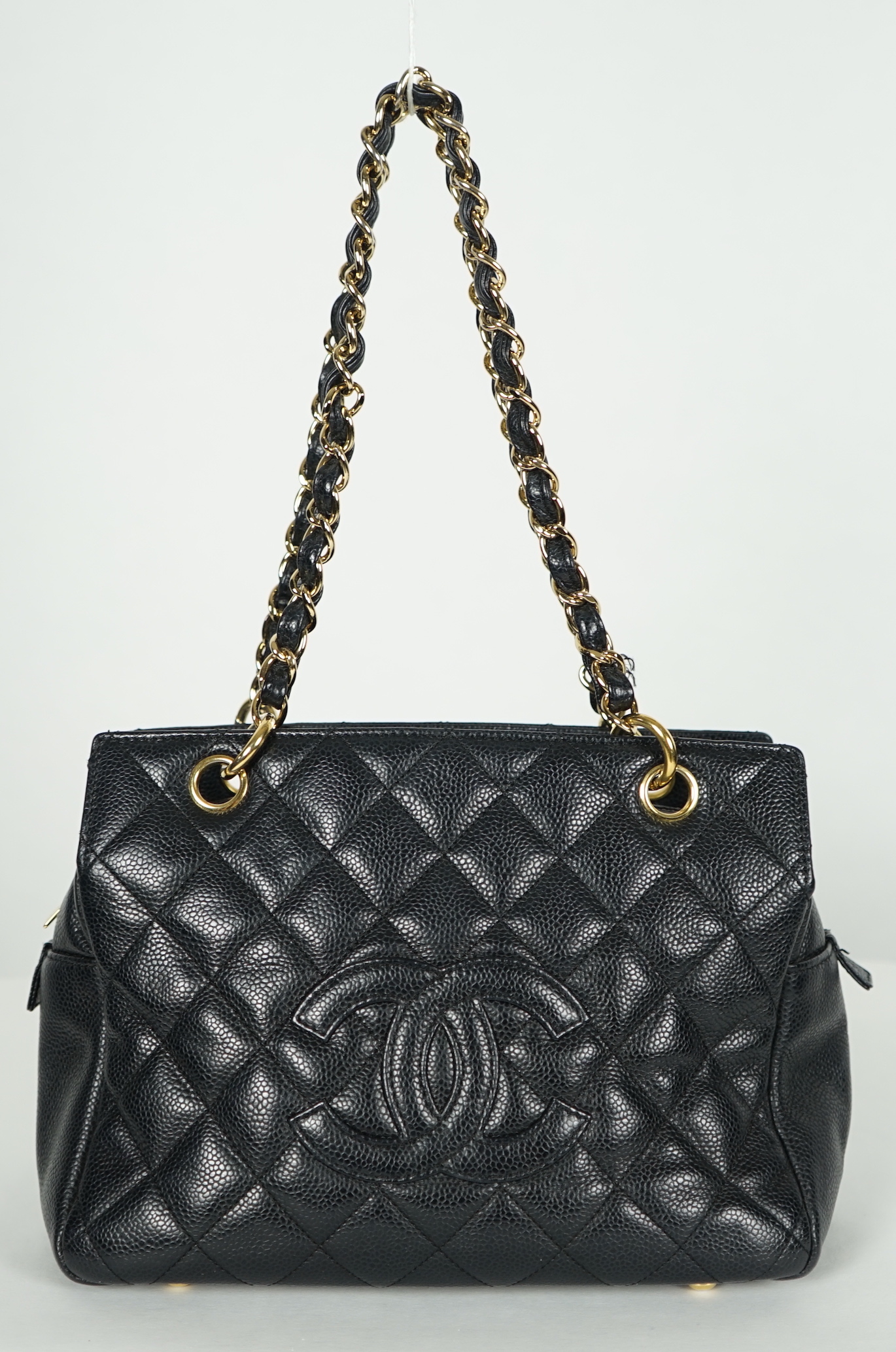 A Chanel Classic Petit Timeless Tote in black caviar with gold hardware, width 26cm, height 19cm, height overall 41cm, depth 13cm., Please note this lot attracts an additional import tax of 20% on the hammer price